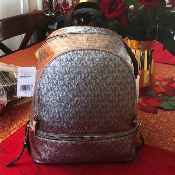 Michael Kors Handbags - Pretty backpack MD silver and black MK